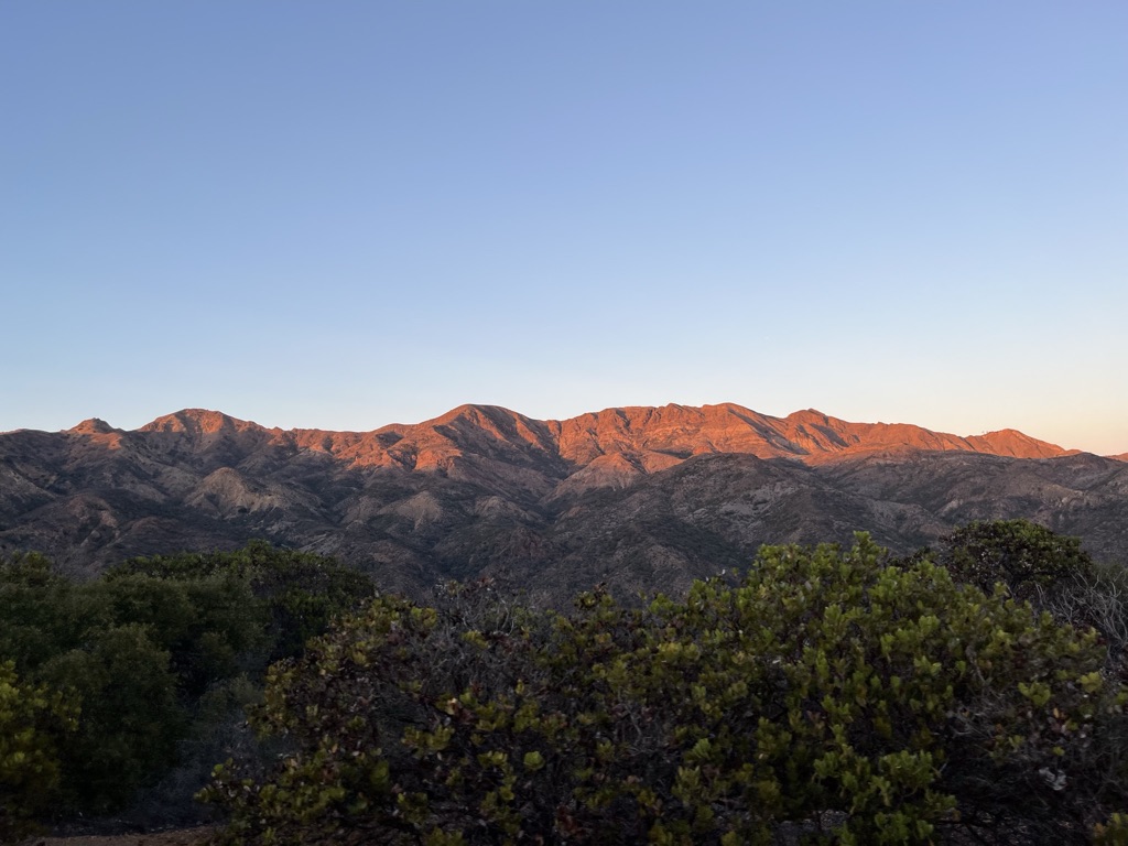 Sunlit mountains and chaparral at sunset